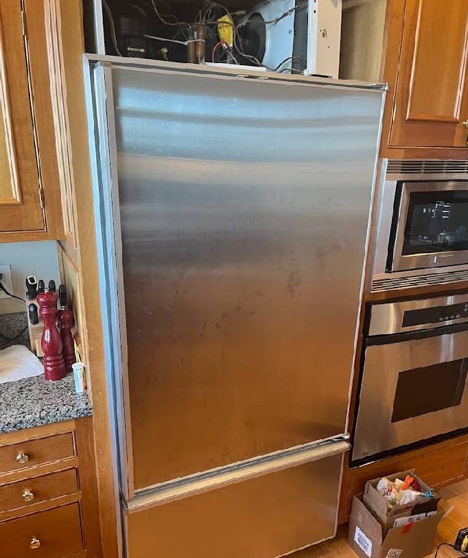 Sub-Zero refrigerator repair in Great Falls, VA — Compressor and condenser compartment fully accessed for repair
