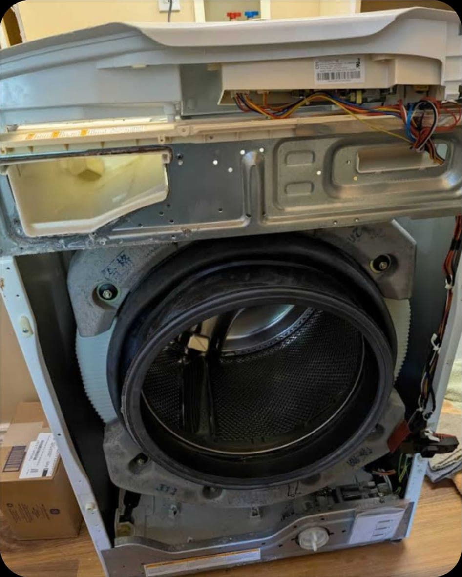 Washer repair in Arlington, VA — The faulty part was replaced and the washer was fully reassembled and tested on site