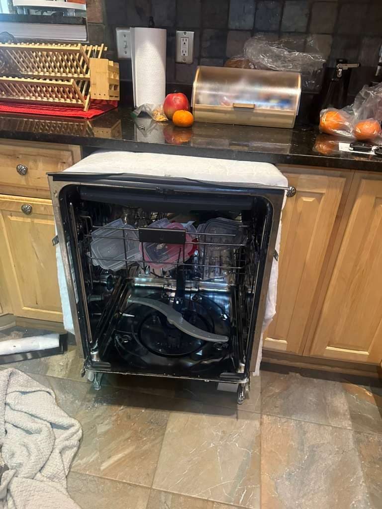 Bosch dishwasher repair in Vienna, VA — The door open, interior tub and spray arms exposed for diagnosis