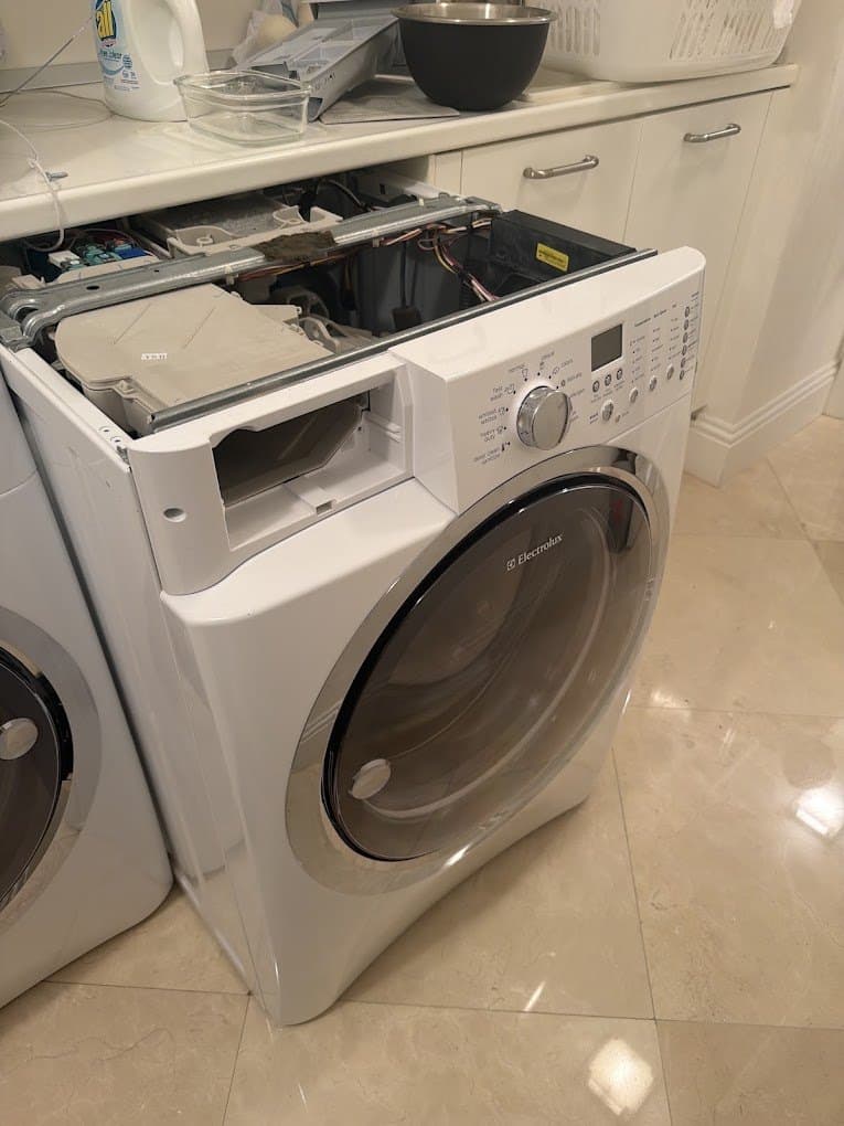 Electrolux washer repair in Chantilly, VA — Front-load washer leaking at the back during fill