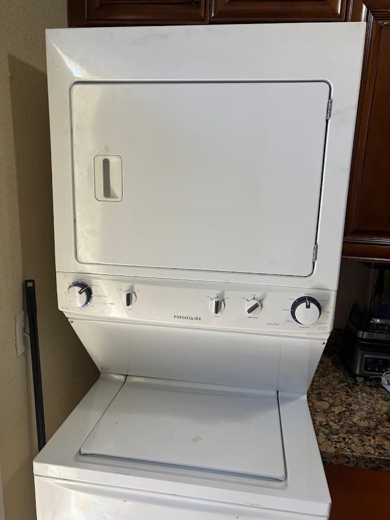 Frigidaire dryer repair in McLean, VA — A stacked dryer running cold and cutting off early