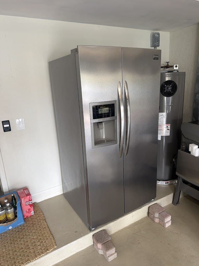 Frigidaire refrigerator repair in Chantilly, VA — Side-by-side running warm and noisy