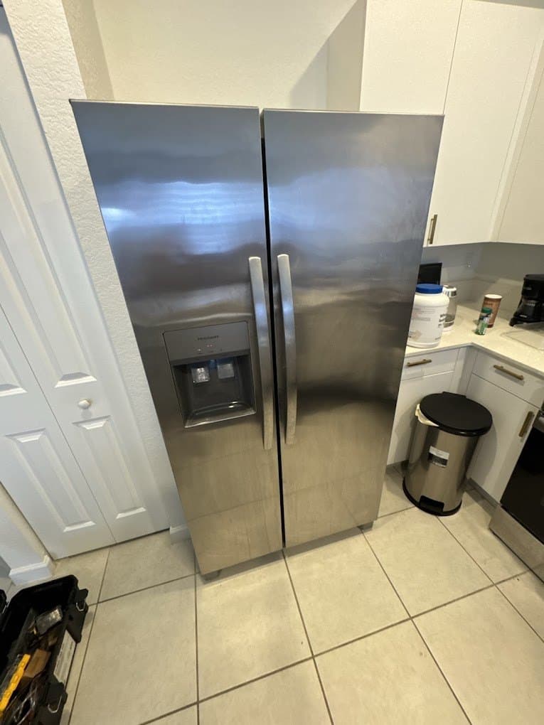 Frigidaire refrigerator repair in Sterling, VA — Ice dispenser jammed on a side-by-side