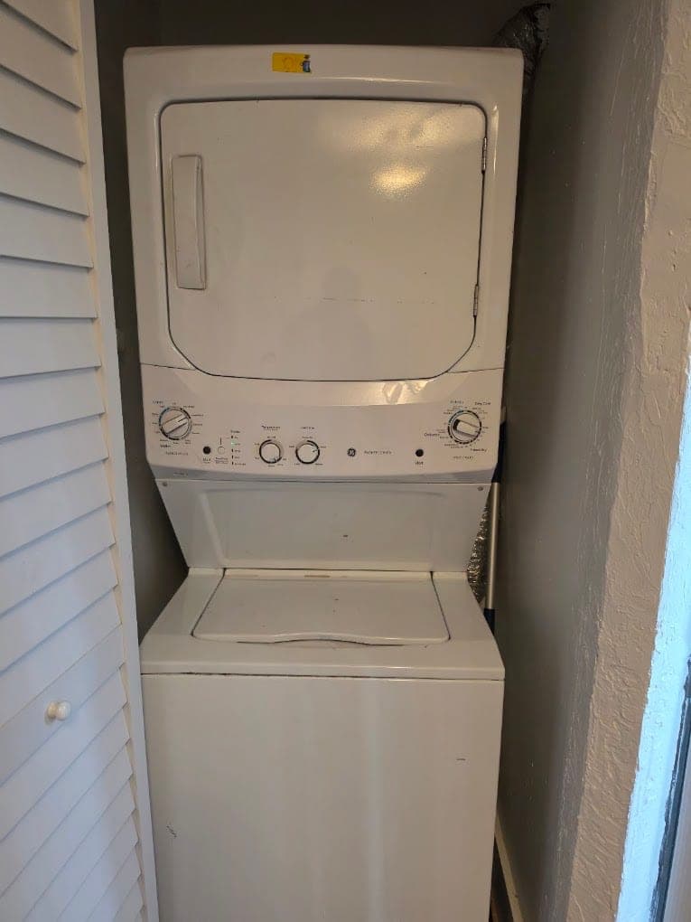 GE dryer repair in Arlington, VA — A laundry-center dryer running with no heat