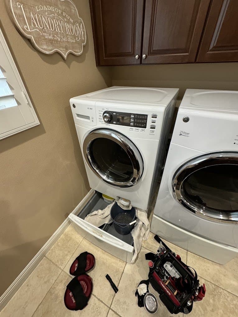 GE dryer repair in Leesburg, VA — Dryer on a pedestal squealing on every cycle
