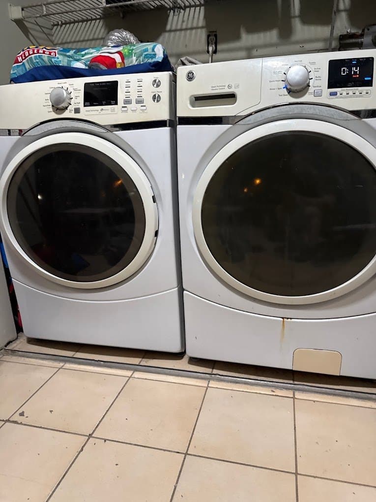 GE dryer repair in Sterling, VA — Dryer ending cycles early with damp clothes