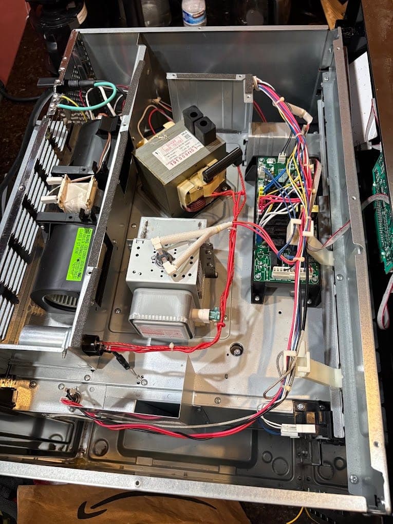 GE microwave repair in Vienna, VA — Power but no heat, opened up to test the magnetron