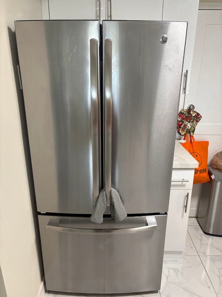 GE refrigerator repair in McLean, VA — A fresh food section running warm