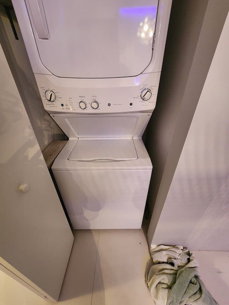 GE laundry combo repair in Herndon, VA — Laundry center washer humming, not agitating
