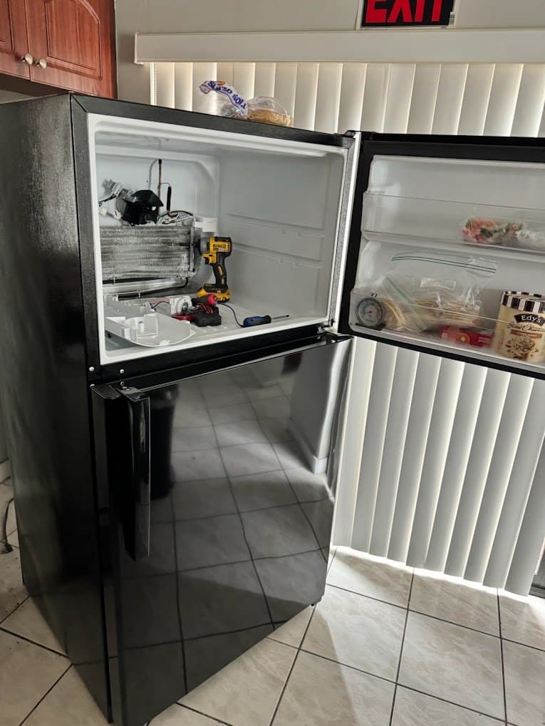 Insignia refrigerator repair in Woodbridge, VA — Top-freezer refrigerator warm in both sections