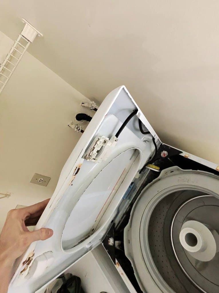Insignia washer repair in Woodbridge, VA — Top-load washer lid hinge broken