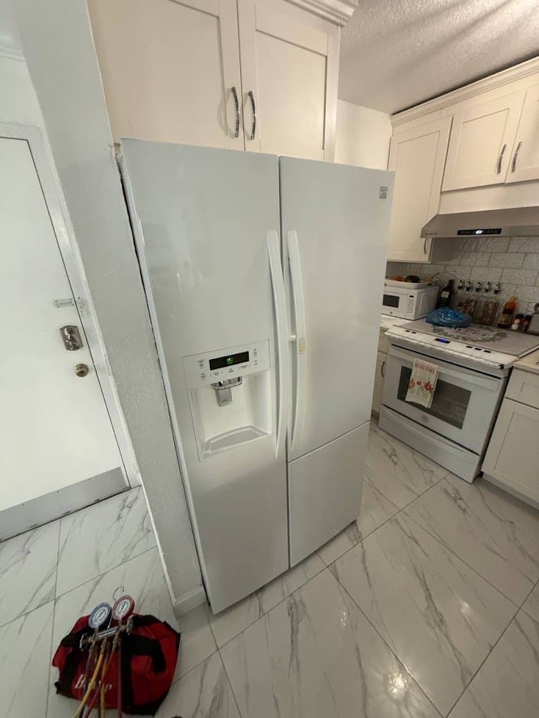 Kenmore refrigerator repair in Manassas, VA — Side-by-side not cooling, refrigerant leak