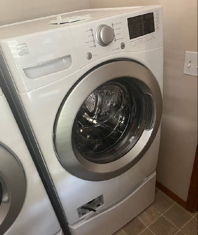 Kenmore washer repair in Vienna, VA — Drum bearing worn, grinding noise building at the start of every spin cycle