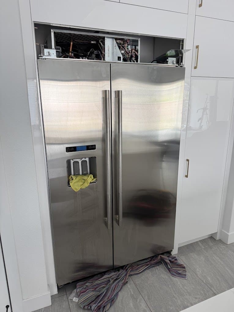 KitchenAid refrigerator repair in Lake Barcroft, VA — Built-in side-by-side cutting out and running warm