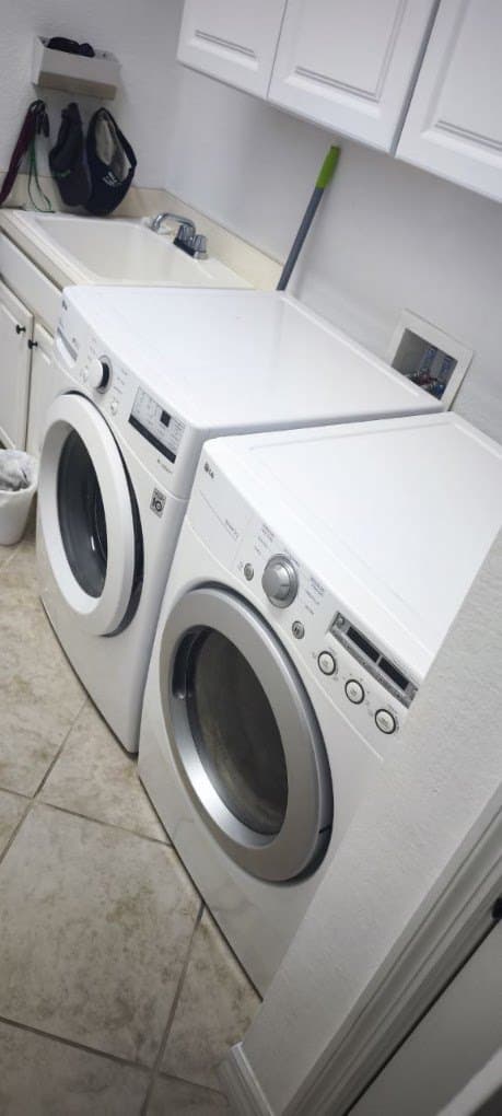 LG dryer repair in Leesburg, VA — Front-load dryer tumbling with no heat