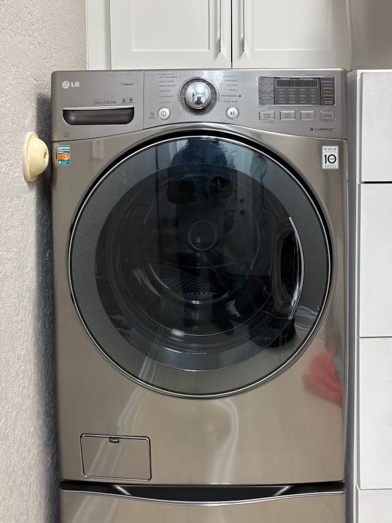 LG washer repair in Annandale, VA — A cycle stopping partway with water in the drum