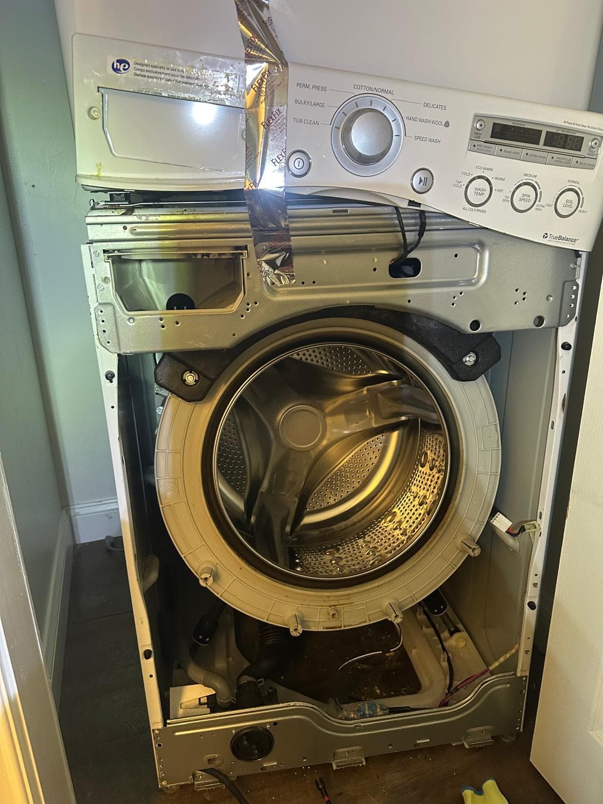LG washer repair in Falls Church, VA — Full disassembly for door boot seal and drum bearing repair