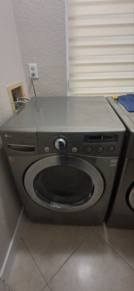 LG washer repair in Fairfax Station, VA — Front-load washer showing a drain error
