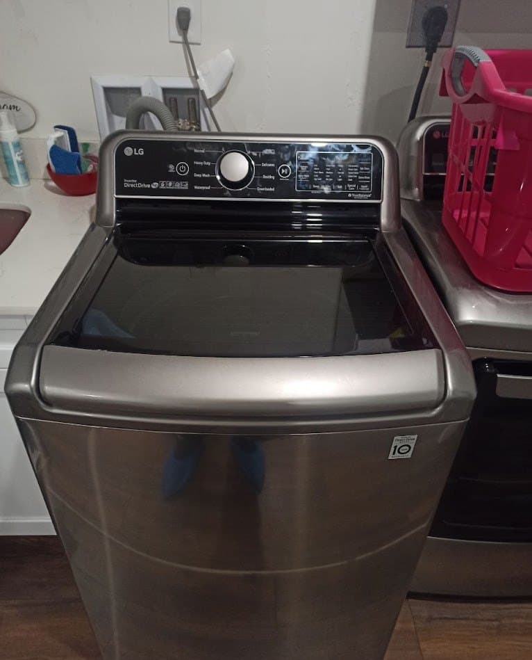 LG washer repair in Herndon, VA — Top-load washer stopping with an unbalance code