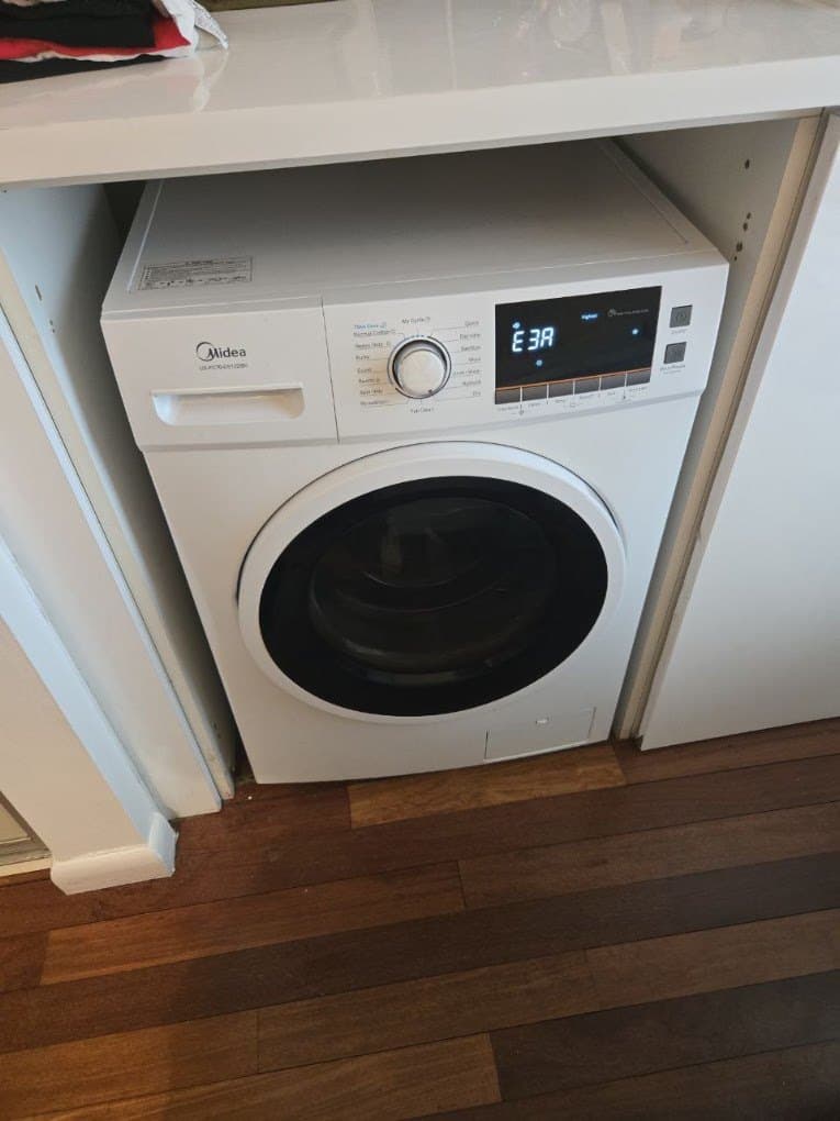 Midea laundry combo repair in Reston, VA — Combo stopped mid-cycle with a door code