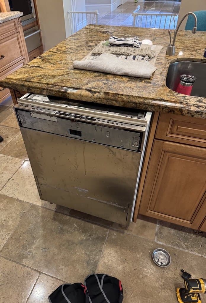 Miele dishwasher repair in Bethesda, MD — Dishwasher door panel loose, door dropping open