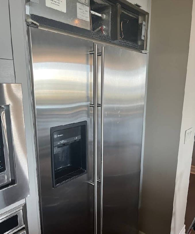 Monogram refrigerator repair in Falls Church, VA — Condenser fan motor seized, refrigerator running warm with compressor cycling constantly