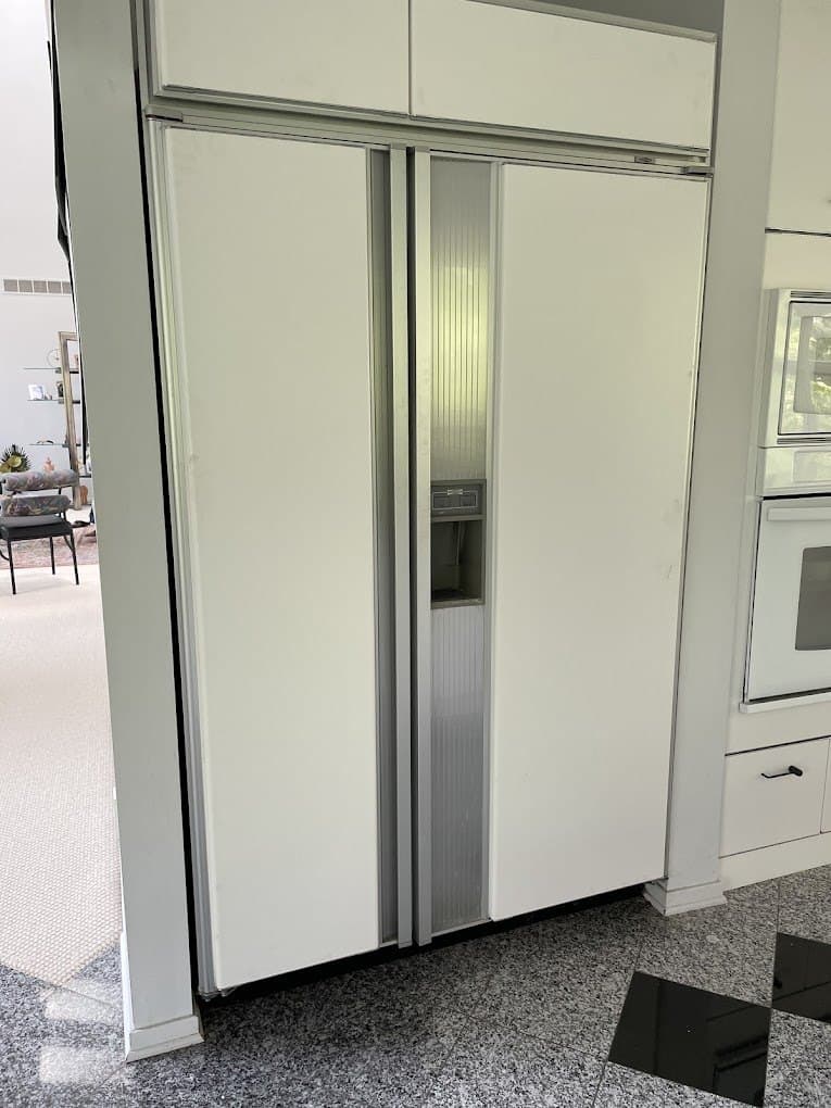 Monogram refrigerator repair in Fairfax Station, VA — Built-in refrigerator clicking and not cooling