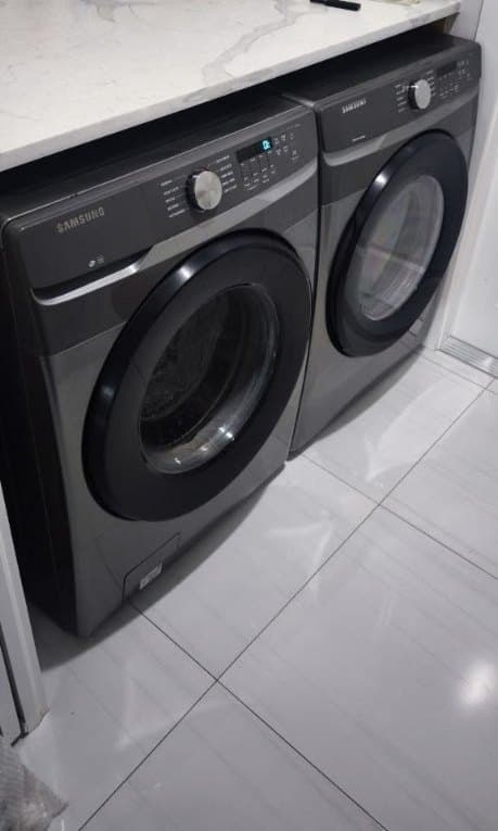 Samsung dryer repair in Springfield, VA — Brushed-black dryer taking too long to dry