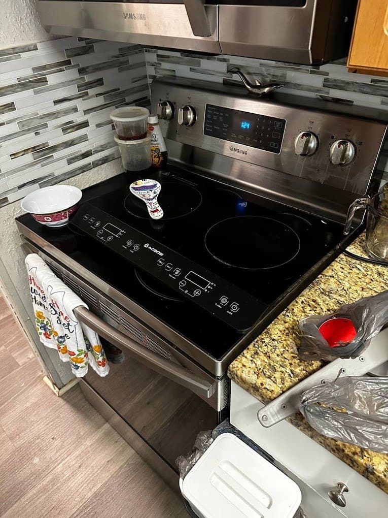 Samsung range repair in Fairfax Station, VA — Two induction zones showing an error