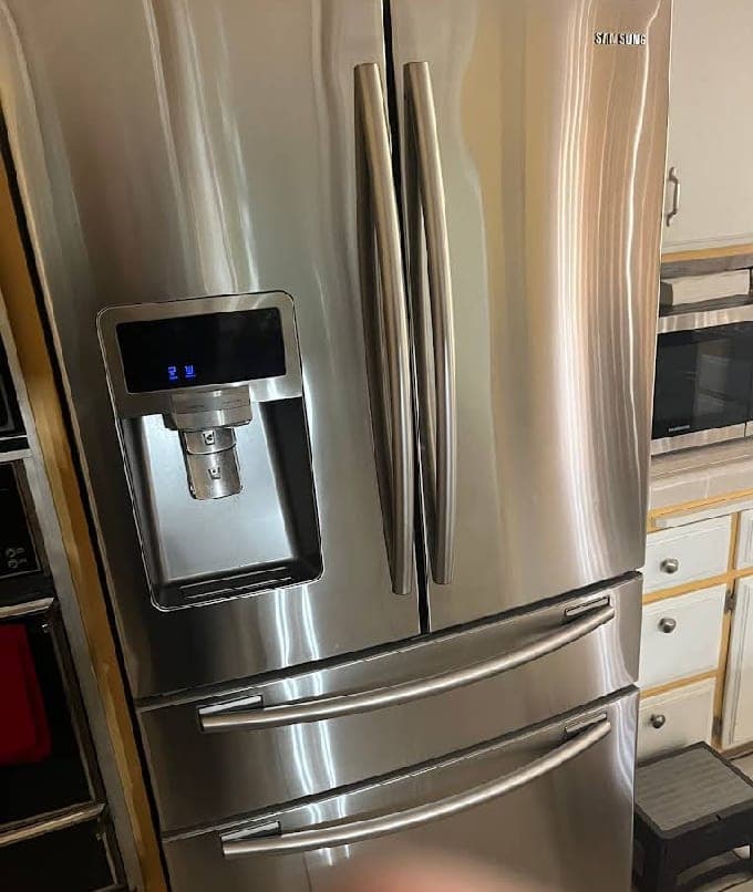 Samsung refrigerator repair in Oakton, VA — Lower freezer drawer seal failing, ice crystals coating all frozen food