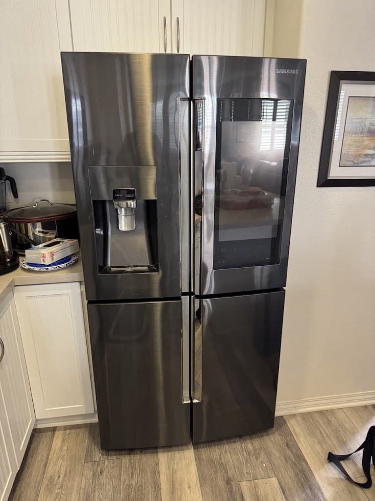 Samsung refrigerator repair in Chantilly, VA — Water leaking under the refrigerator