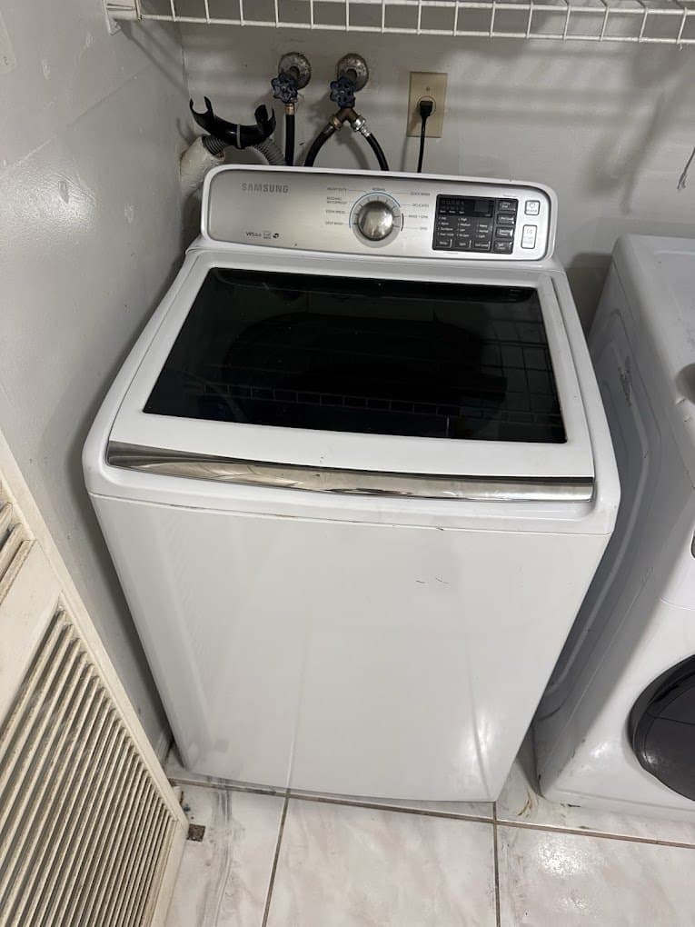 Samsung washer repair in Manassas, VA — Top-load washer stopping with a lid lock code before spin