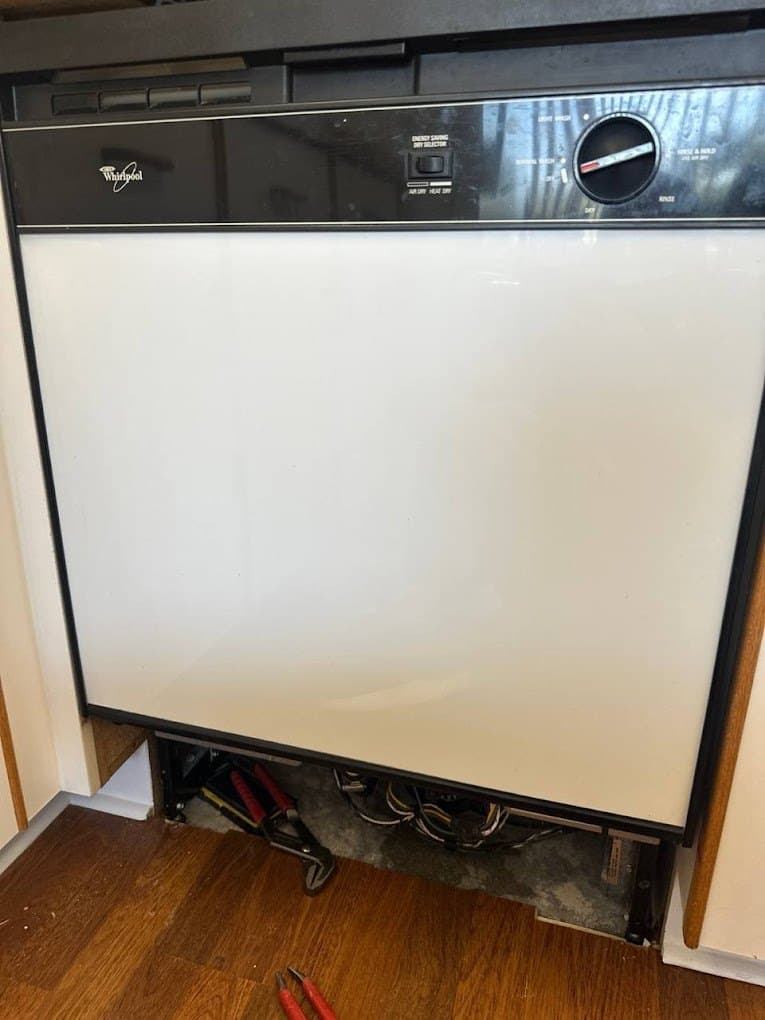 Whirlpool dishwasher repair in Arlington, VA — Dishwasher leaking at the front