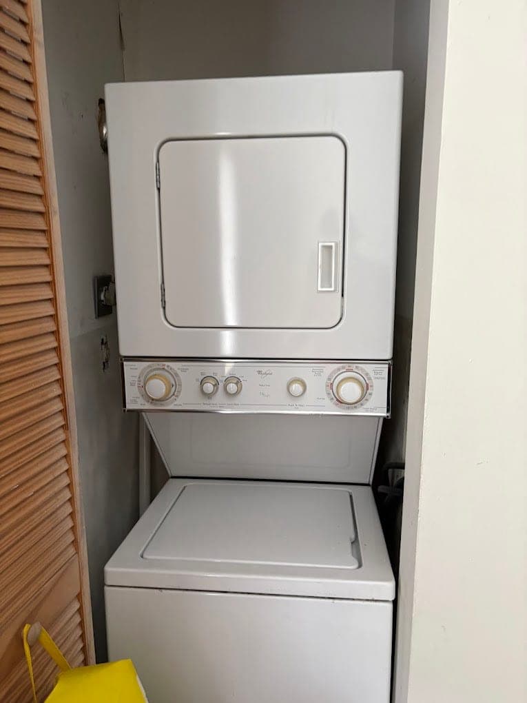 Whirlpool dryer repair in Tysons, VA — A stacked dryer tumbling with no heat
