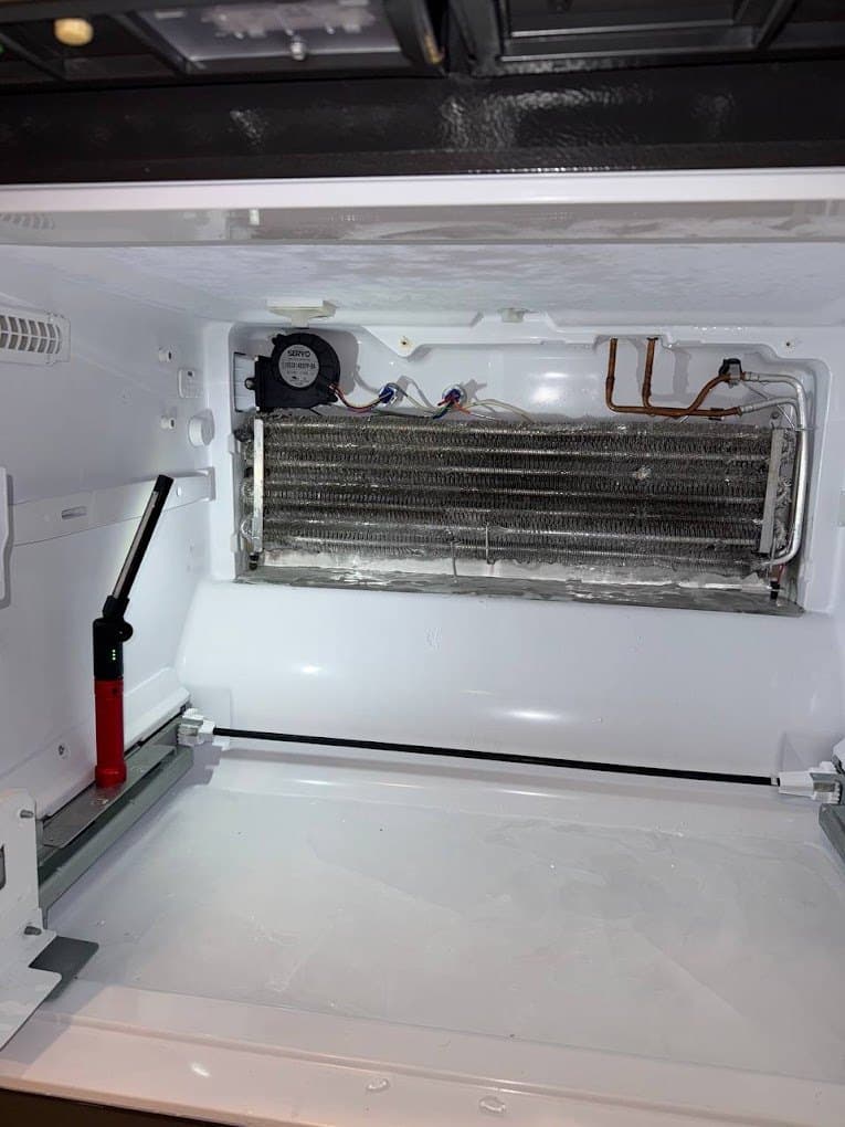 Whirlpool freezer repair in Leesburg, VA — Top freezer not freezing, fan silent