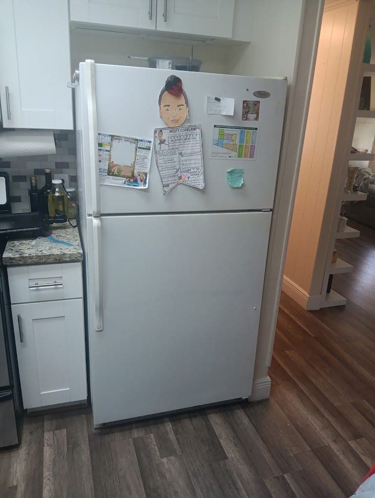 Whirlpool refrigerator repair in Fairfax, VA — A frosted-over freezer, warm fresh food side