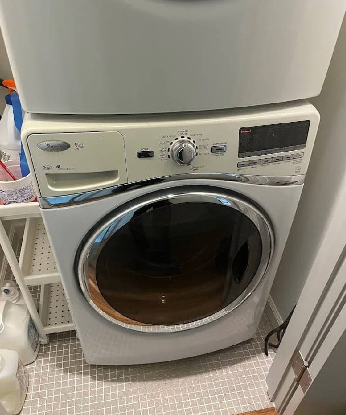 Whirlpool washer repair in Falls Church, VA — Door boot gasket torn, water pooling on the floor with every wash cycle