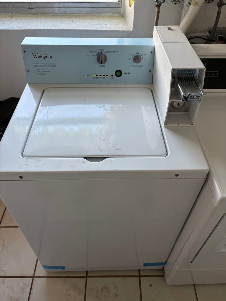 Whirlpool washer repair in Great Falls, VA — A coin-op washer filling slowly and stalling