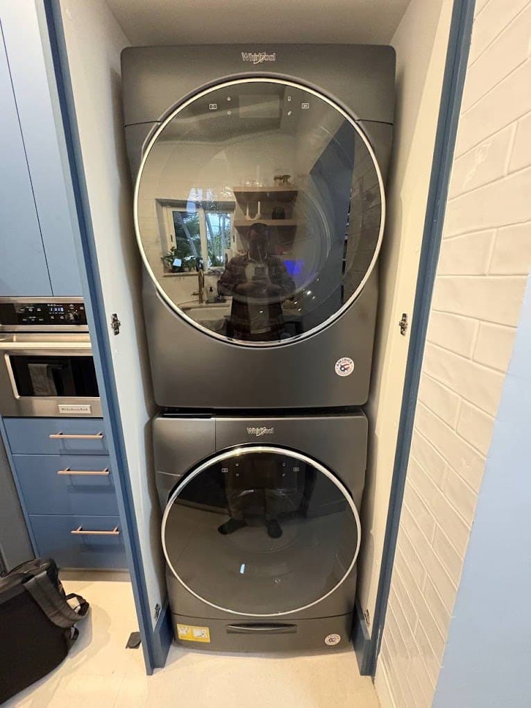 Whirlpool washer repair in Rockville, MD — A stacked washer that stopped mid-cycle full of water