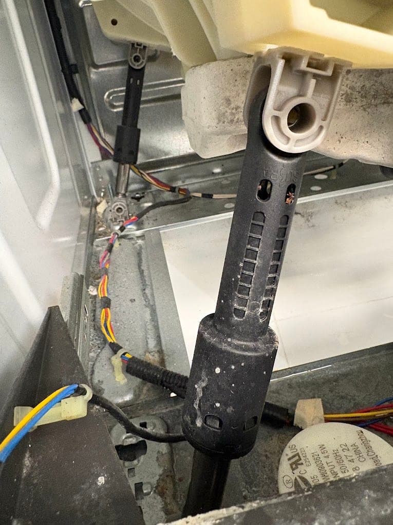 Whirlpool washer repair in Tysons, VA — Hard banging in spin from worn suspension rods