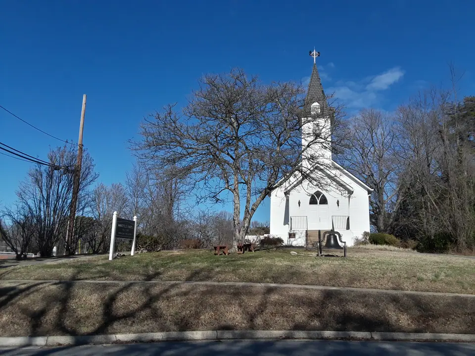 Wakefield Chapel, the historic white chapel on Wakefield Chapel Road in Annandale, Virginia, under a clear winter sky