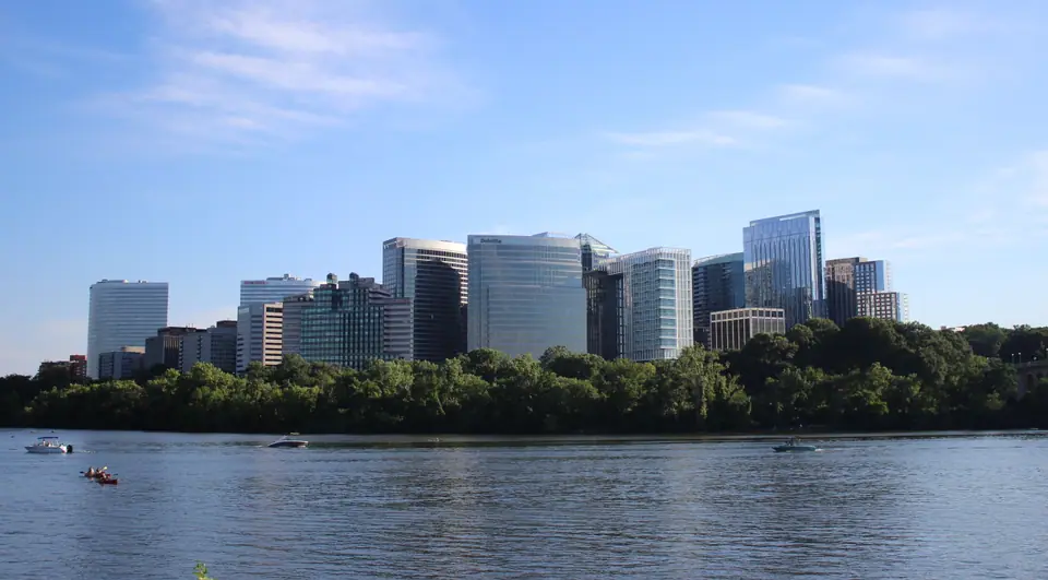The Rosslyn skyline in Arlington, Virginia, seen across the Potomac River on a sunny summer day