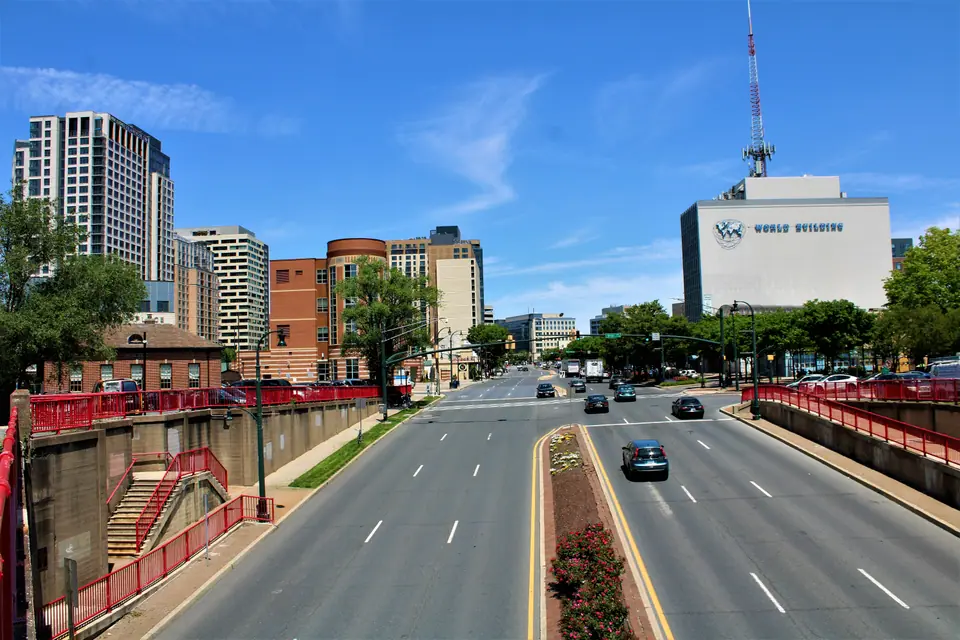 Georgia Avenue heading north into downtown Silver Spring, Maryland, with the World Building and the downtown high-rises under a blue sky